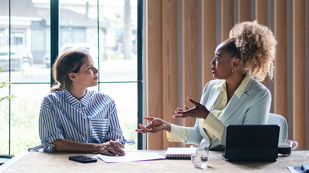 a meeting between 2 people in a work setting