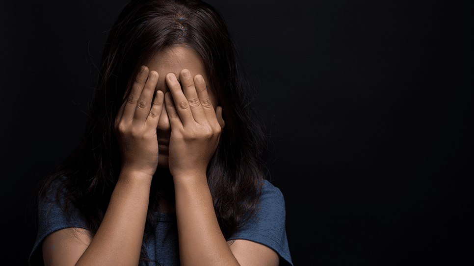 girl covering eyes