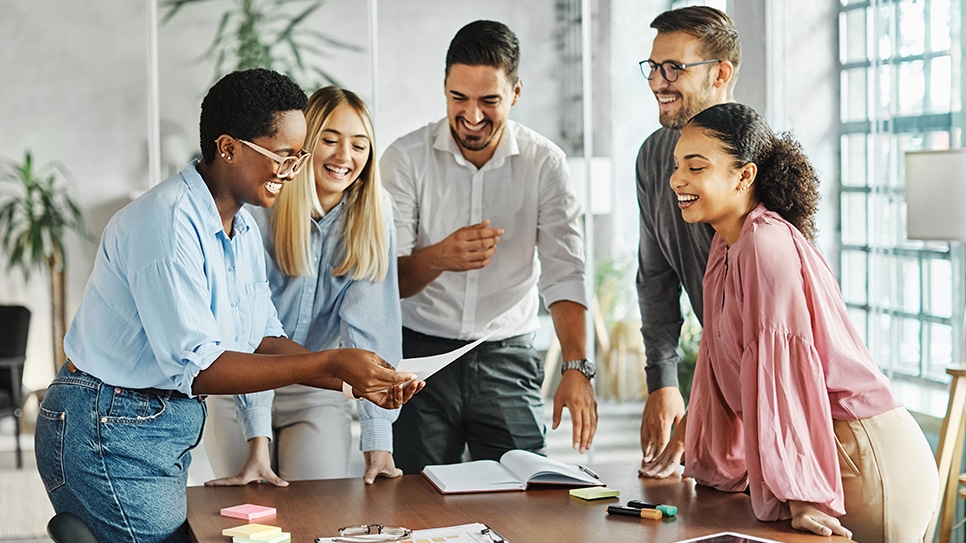 group of coworkers gathered and smiling