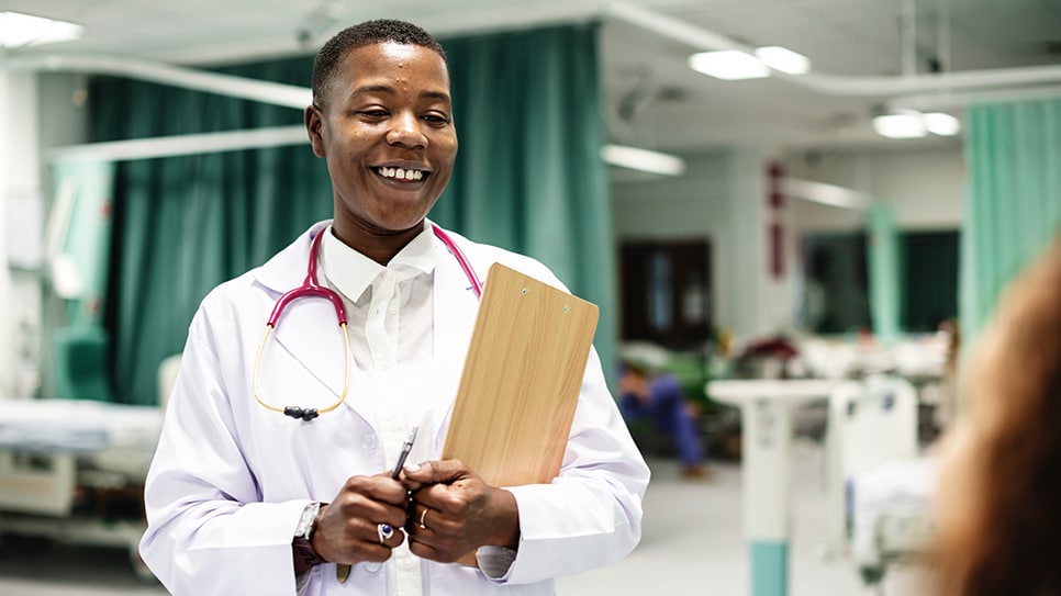 Doctor talking to her patient in the hospital
