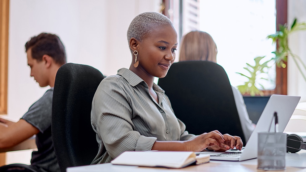 African-American woman typing on a keyboard