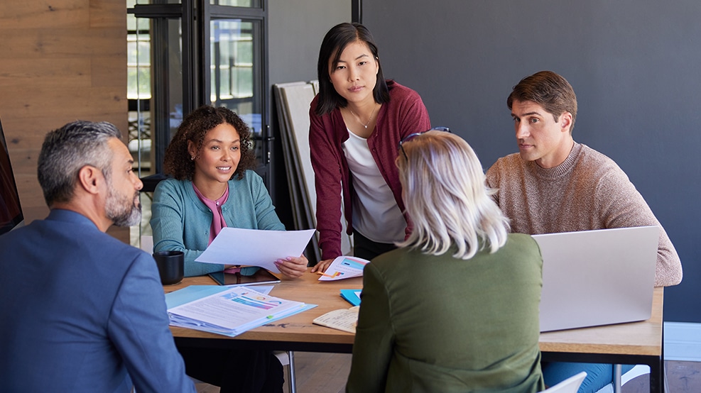 Group of coworkers gathered in a conference room