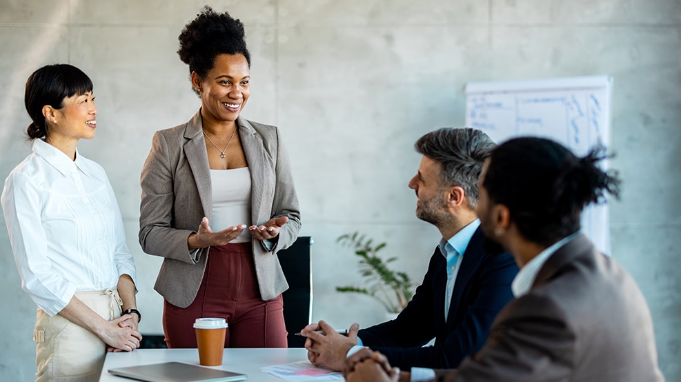HR leader addressing a diverse group of coworkers